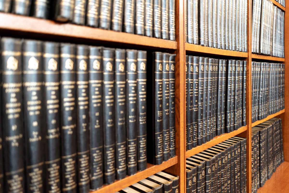 Rows of legal reference books on wooden shelves