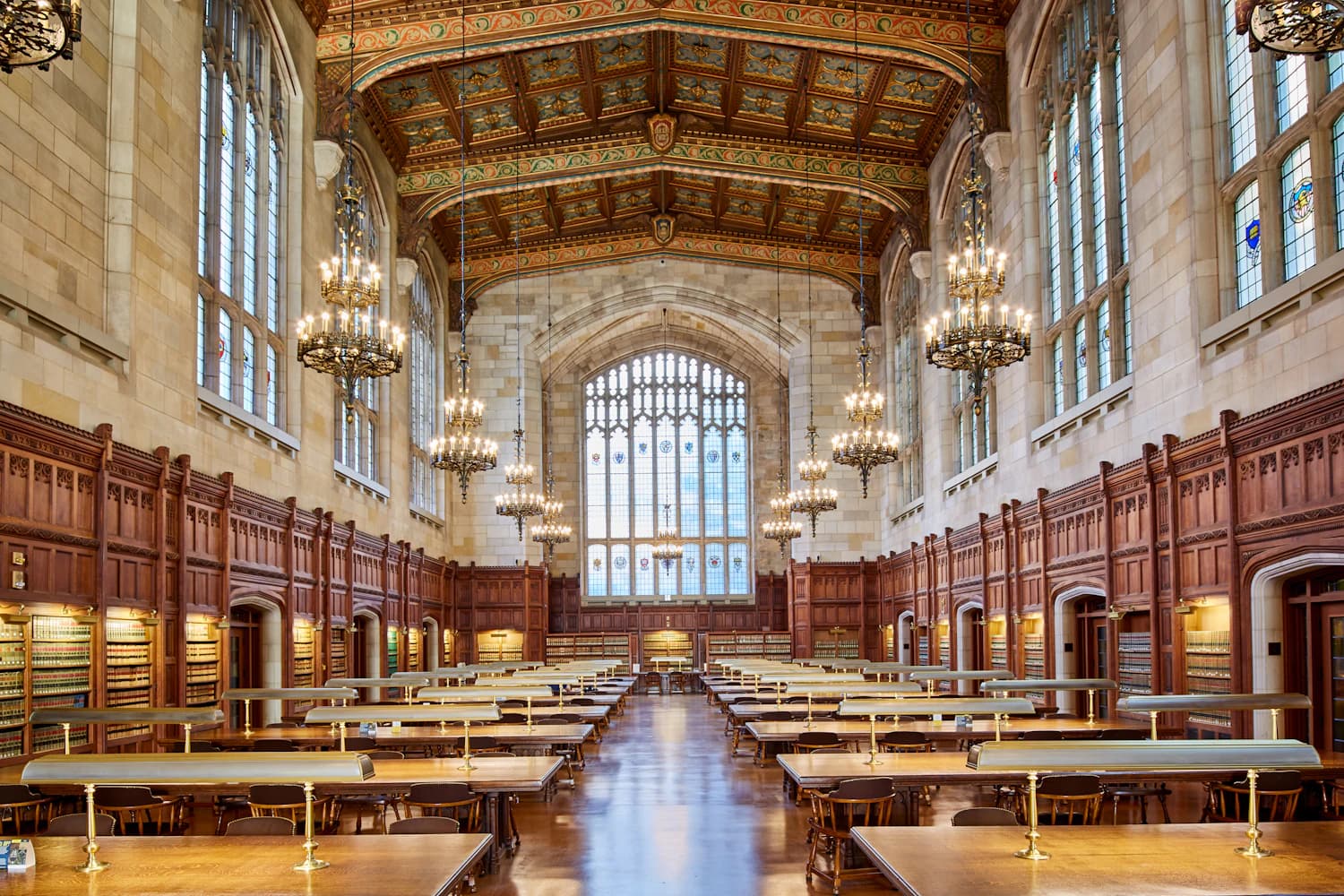 Interior of a law library with desks, bookshelves and chandeliers